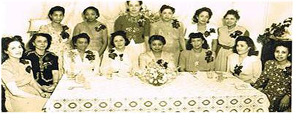 (standing left to right Sorors Elizabeth M. Pindle, Geneva Harper Puryear, Mary Bullock Kidd, Lenora P. Williams, Josephine Brown Dutton, Jeanette Harrison Anderson; seated left to right Soror Lena R. Perry Martin, Louise B. Davis, Maudestine D. Manning, Lillian P. Smith (in the middle in front of flowers is Marguerite Adams former South-Atlantic Regional Director) Doris Orr, Julia Mason Moses, Lois Taylor not pictured are Sorors Anne Cooke, Margaret Gillespie Cooper, Sadie Harvey)